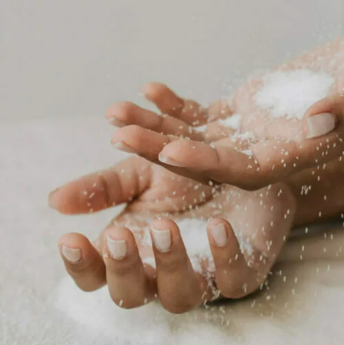 2 hands covered in talcum powder