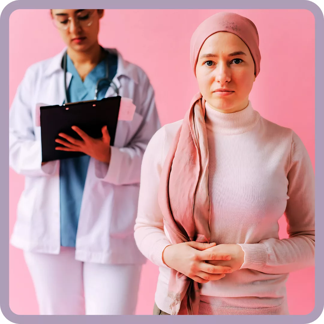 woman in pink standing with her doctor against a pink backdrop